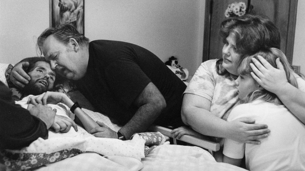 David Kirby, an HIV/AIDS activist, near death, surrounded by his family in Ohio, 1990.