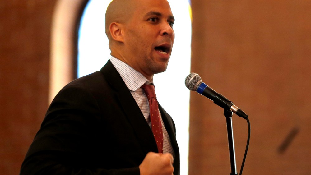 Newark Mayor Cory Booker talks to firefighter cadets during a swearing in ceremony into the Newark Fire Department. (Photo by Julio Cortez/AP)