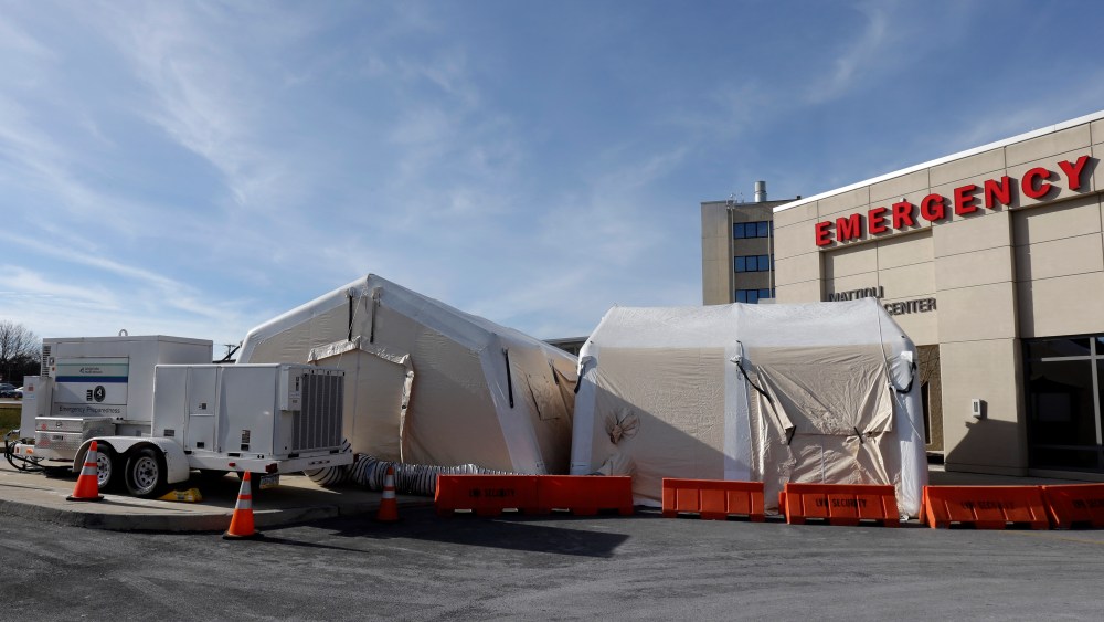A tent is set up for a patients with flu symptoms, just outside the emergency entrance at the Lehigh Valley Hospital Thursday, Jan. 10, 2013, in Allentown, Pa. The Pennsylvania Department of Health designated flu as now "widespread" throughout the...