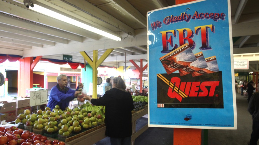 A sign announcing the acceptence of electronic Benefit Transfer cards is seen at the Denios Farmers market in Roseville, Calif., Saturday,  Feb. 6, 2010.   (AP Photo/Rich Pedroncelli)