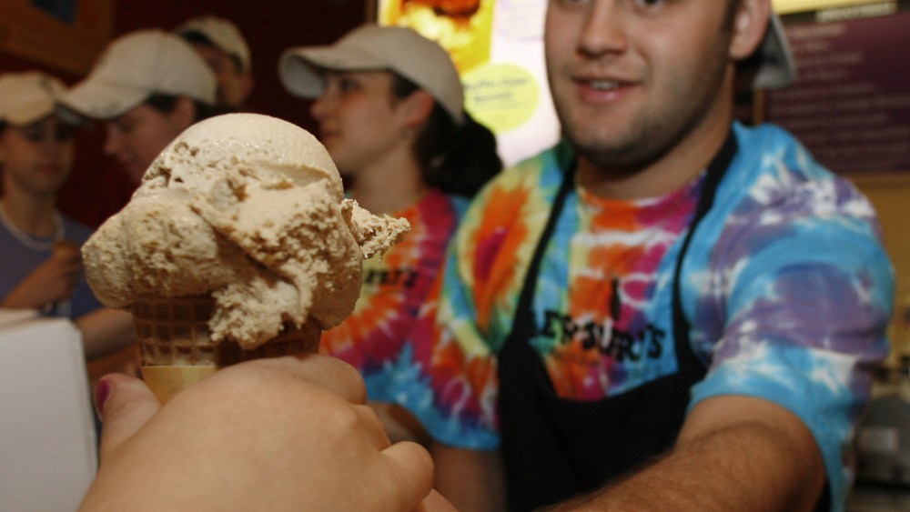 Aleck Woodmaster serves up a free ice cream cone at the Ben & Jerry's shop in Montpelier, Vt., Tuesday, April 25, 2006. The ice cream maker held its annual free cone day around the world and expects to give away more than a million cones. (AP Photo...