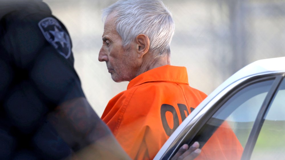 Robert Durst is escorted into Orleans Parish Prison after his arraignment in Orleans Parish Criminal District Court in New Orleans, on March 17, 2015.