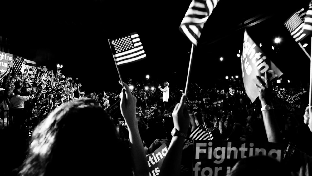 Supporters wave American flags at a rally for Presidential candidate Hillary Clinton on March 1, 2016. (Photo by Mark Peterson/Redux for MSNBC)