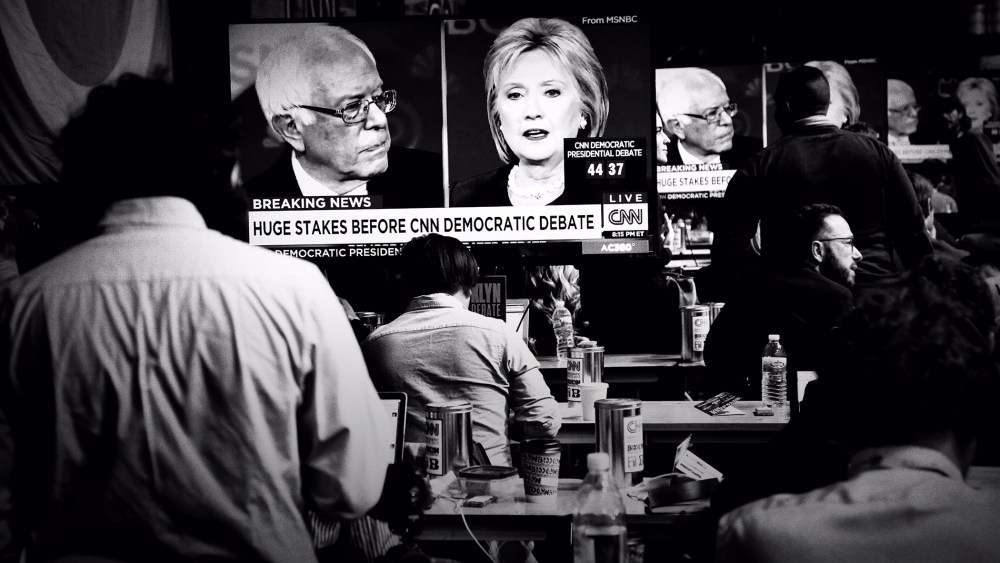 Bernie Sanders and Hillary Clinton are seen sparring on televisions in the reporters' filing room at the CNN Debate in Brooklyn, N.Y., April 14, 2016. (Photo by Mark Peterson/Redux for MSNBC)