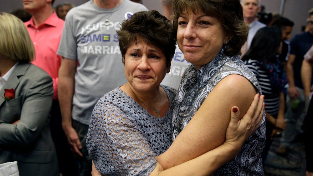 Mercy Leonard, left, embraces Gwen Leonard after an appeals court ruling that overturned Nevada's gay marriage ban on Oct. 7, 2014, in Las Vegas.
