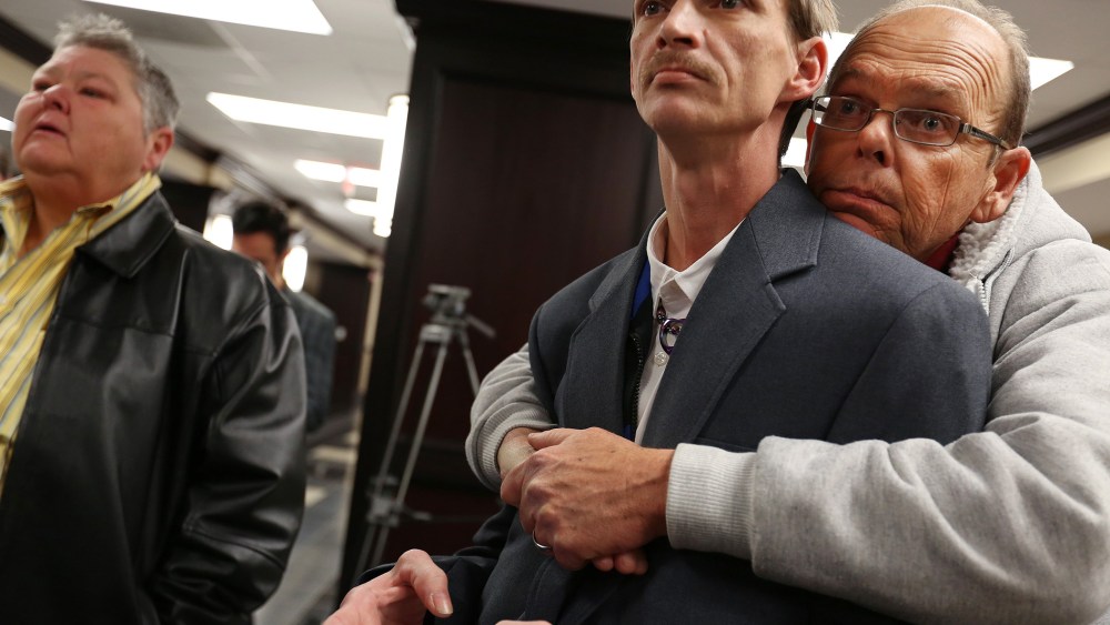 John Humphrey, left, and James Strawser wait for a marriage license along with several other gay couples at the Mobile County Probate office in Mobile, Ala., on Feb. 10, 2015. (Photo by Sharon Steinmann/AL.com/AP)