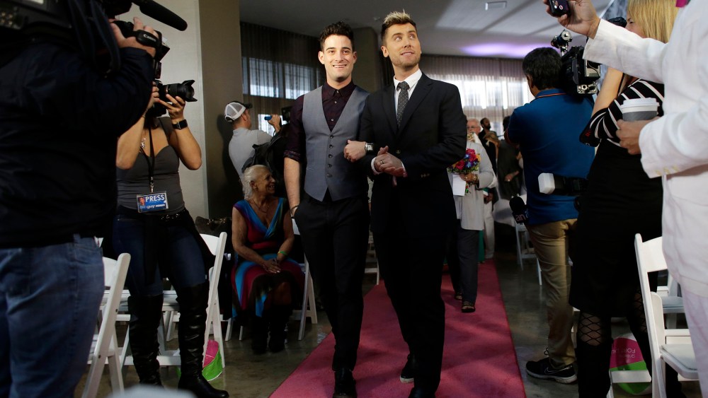 Michael Turchin, left, and Lance Bass,right, arrive for a group wedding ceremony at a hotel in honor of Florida's ruling in favor of same-sex marriage equality, Feb. 5, 2015, in Fort Lauderdale, Fla. (Photo by Lynne Sladky/AP)
