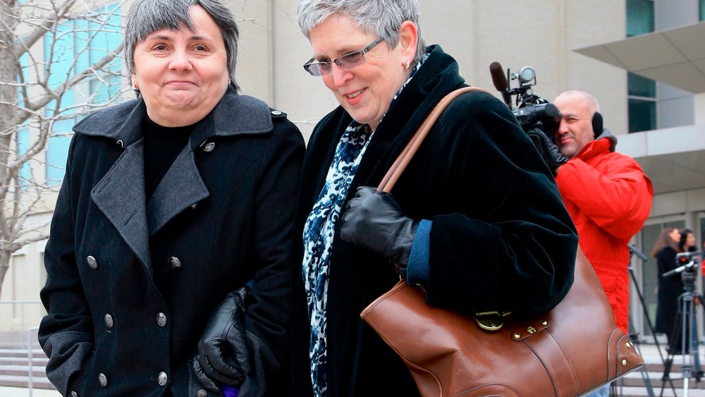 Susan Waters, left, and Sally Waters walk away from Federal Court in Omaha, Neb., after a hearing, Feb. 19, 2015. (Photo by Nati Harnik/AP)
