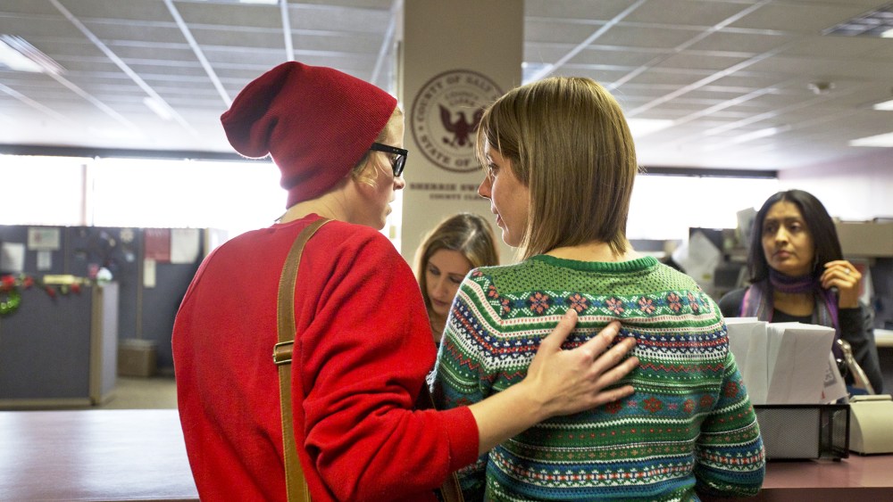 Samantha Christensen and Elise Larsen apply for a marriage license in the Salt Lake County Clerk's Office, Dec. 23, 2013.