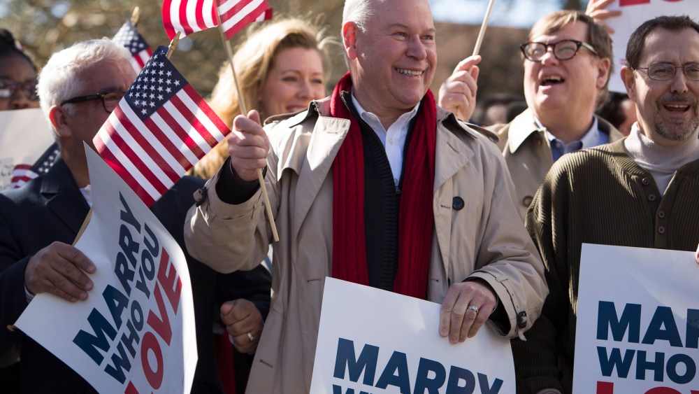 Robert Roman and Claus Ihlemann of Virginia Beach celebrate with Carol Schall, Mary Townley , Tim Bostic and Tony London, Thursday's ruling that Virginia's same-sex marriage ban was unconstitutional.