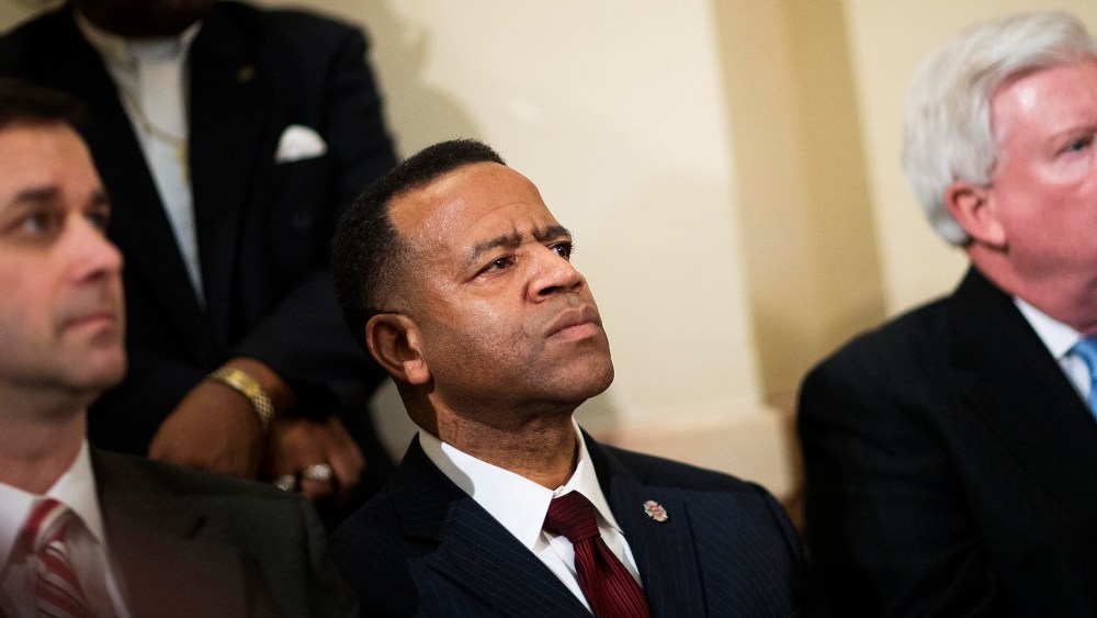 Former Atlanta fire chief Kelvin Cochran, second from left, listens during a rally by religious groups supporting Cochran following his termination, on Jan. 13, 2015, in Atlanta. (Photo by David Goldman/AP)