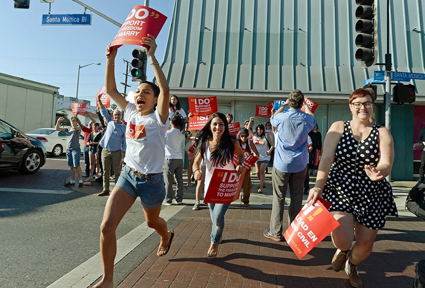 People celebrate in the street after the Supreme Court ruling at a watch party at Equality California, a non-profit civil rights organization that advocates for the rights of LGBT people in California, on June 26, 2013 in West Hollywood, California. ...