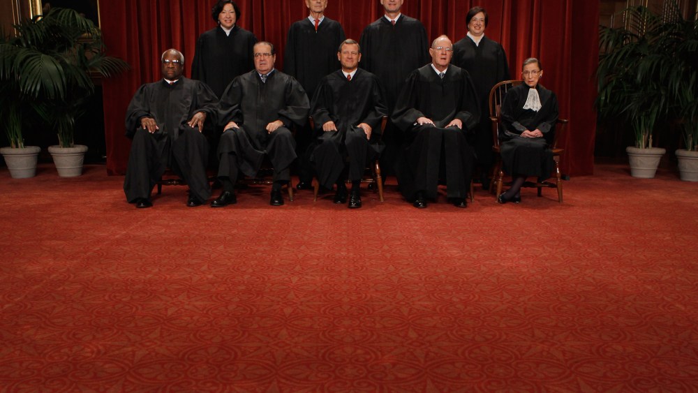 U.S. Associate Justices Clarence Thomas, Antonin Scalia, Chief Justice John Roberts, Associate Justices Anthony Kennedy, Ruth Bader Ginsburg, Sonia Sotomayor, Stephen Breyer, Samuel Alito and Elena Kagan. (Photo by Chip Somodevilla/Getty)