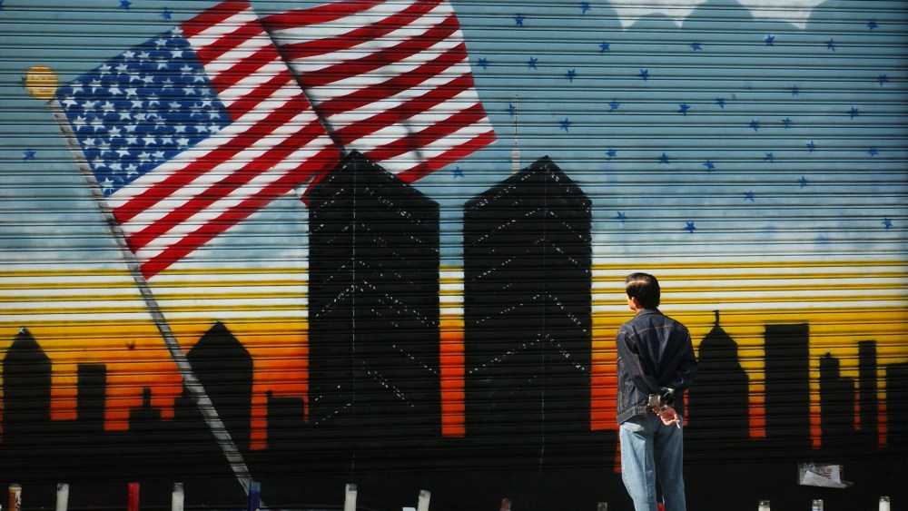 A man pauses to look at a mural in Brooklyn on Sept. 18, 2001 in memory of the World Trade Center and the over 5,000 people who died in the terrorist attack. (Photo by Spencer Platt/Getty)
