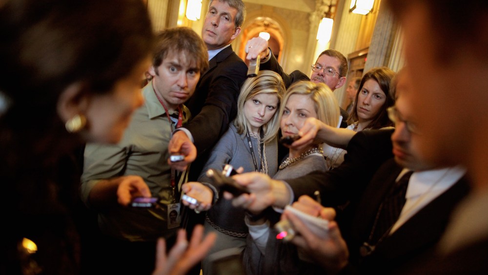 Reporters crowd around U.S. Sen. Olympia Snowe (R-ME) (L) as she heads into weekly Senate Republican policy luncheon at the U.S. Captiol November 29, 2011 in Washington, D.C.
