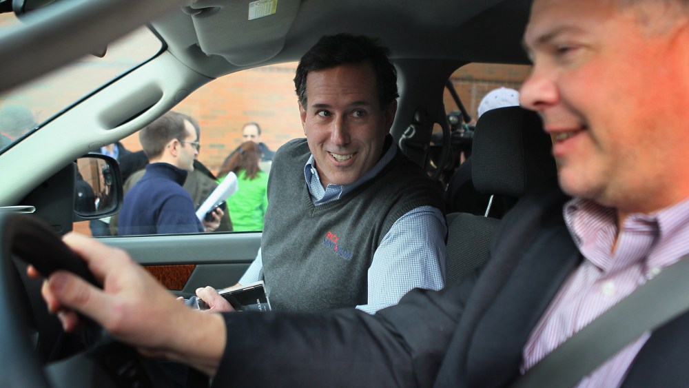 Republican presidential candidate Rick Santorum gets into his campaign vehicle, a Dodge truck dubbed the "Chuck Truck" that is driven by Chuck Laudner on Dec. 31, 2011 in Indianola, Ia. (Photo by Scott Olson/Getty)