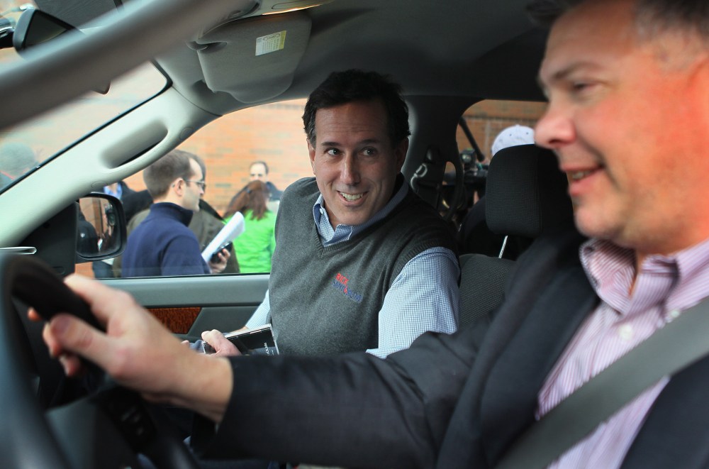 Republican presidential candidate Rick Santorum gets into his campaign vehicle, a Dodge truck dubbed the "Chuck Truck" that is driven by Chuck Laudner on Dec. 31, 2011 in Indianola, Ia. (Photo by Scott Olson/Getty)