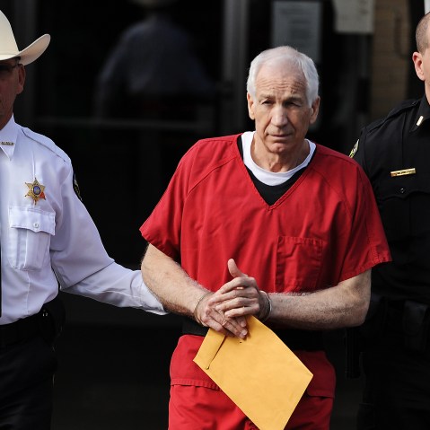 Former Penn State assistant football coach Jerry Sandusky leaves the Centre County Courthouse after being sentenced in his child sex abuse case on Oct. 9, 2012 in Bellefonte, Penn. (Photo by Patrick Smith/Getty)
