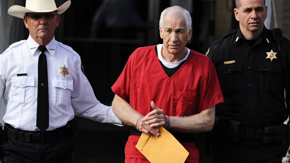 Former Penn State assistant football coach Jerry Sandusky leaves the Centre County Courthouse after being sentenced in his child sex abuse case on Oct. 9, 2012 in Bellefonte, Penn. (Photo by Patrick Smith/Getty)