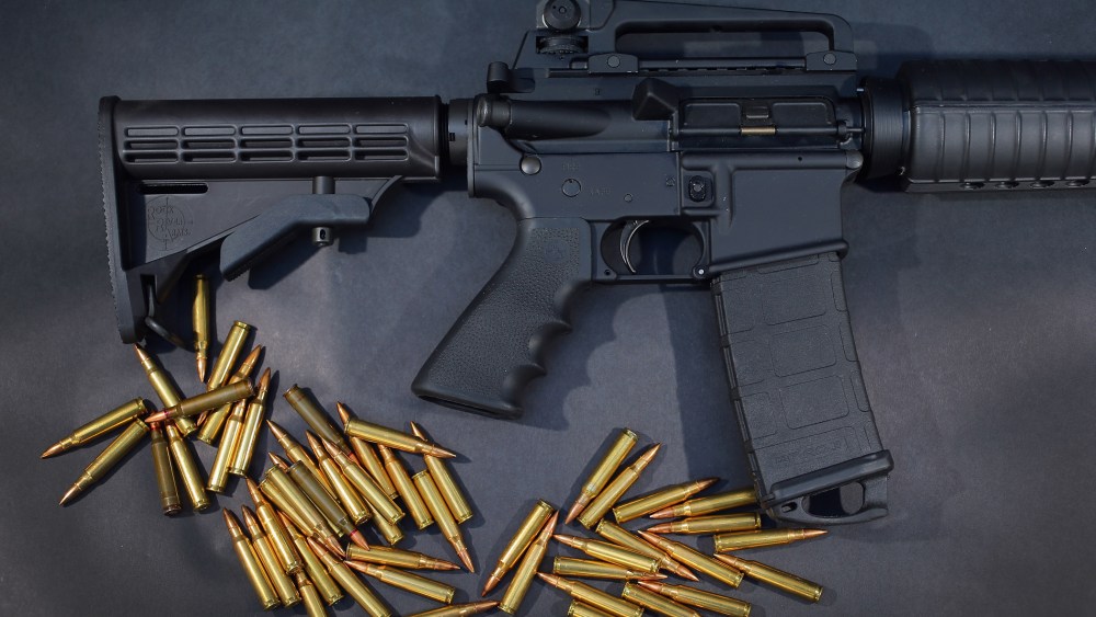 In this photo illustration, an AR-15 rifle is seen with ammunition on Dec. 18, 2012 in Miami, Fla. (Photo by Joe Raedle/Getty)