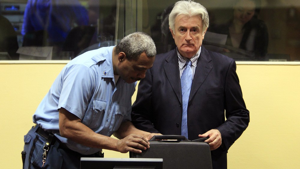 A security guard opens the suitcase of former Bosnian Serb leader Radovan Karadzic in the Hague at the International Criminal Tribunal for the former Yugoslavia facing indictment for alleged war crimes, March 3, 2009. (Photo by Jerry Lampen/AFP/Getty)