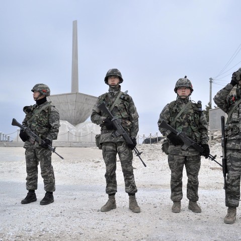 South Korean soldiers look at the sea as they patrol on the South-controlled island of Yeonpyeong near the disputed waters of the Yellow Sea at dawn on April 15, 2013. (Photo by Jung Yeon-Je/AFP/Getty)