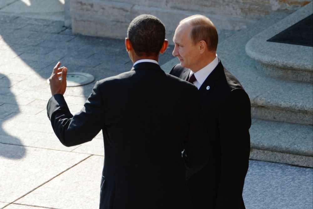 Russian President Vladimir Putin greets U.S. President Barack Obama at the G20 summit on September 5, 2013 in St. Petersburg, Russia. (Photo by Alexei Danichev/Host Photo Agency/Getty)