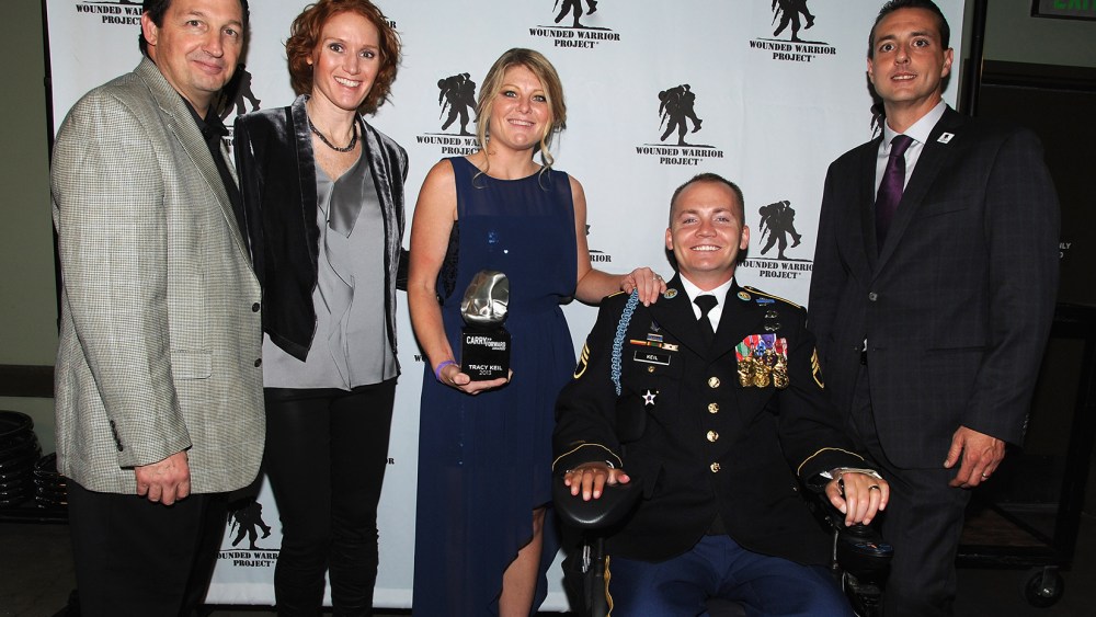 Al Giordano (far left), Steve Nardizzi (far right) and The Carry Forward Awardees attends the Wounded Warrior Project Carry Forward Awards Show at Club Nokia on Oct. 10, 2013 in Los Angeles, Calif. (Photo by Bobby Bank/WireImage/Getty)