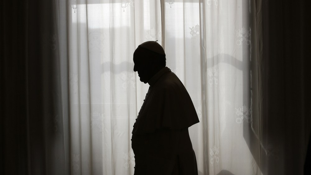 Pope Francis is silhouetted at the Vatican on Oct. 25, 2013. (Photo by Max Rossi/AFP/Getty)