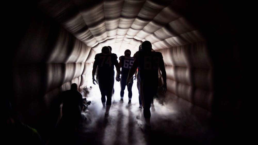 Football players on Oct. 27, 2013 in Minneapolis, Minn. (Photo by Hannah Foslien/Getty)