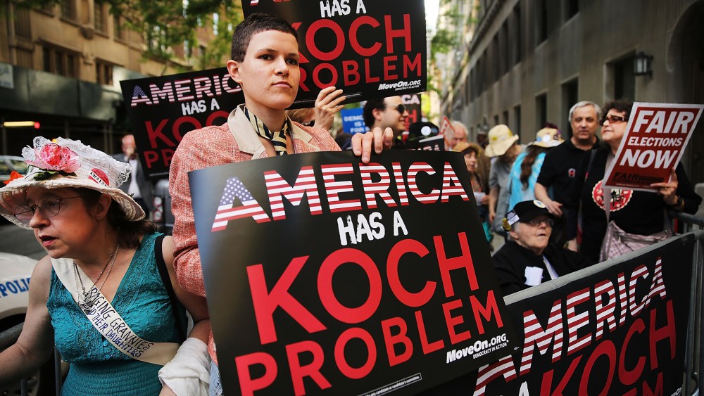 Activists hold a protest near the Manhattan apartment of billionaire and Republican financier David Koch on June 5, 2014 in New York City. (Photo by Spencer Platt/Getty)