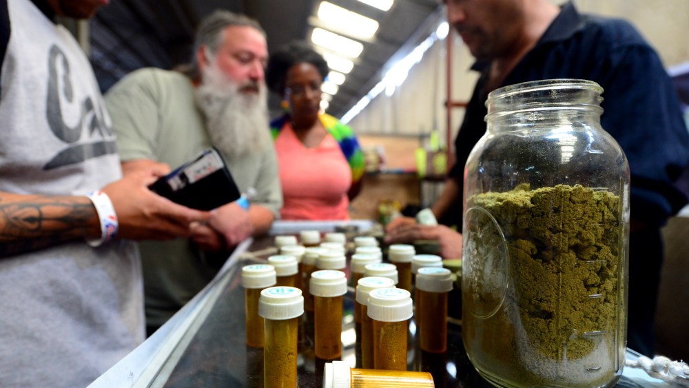 Card-carrying medical marijuana patients learn about Kief, in jar, at Los Angeles' first-ever cannabis farmer's market at the West Coast Collective medical marijuana dispensary, on Independence Day, July 4, 2014. (Photo by Frederic J. Brown/AFP/Getty)