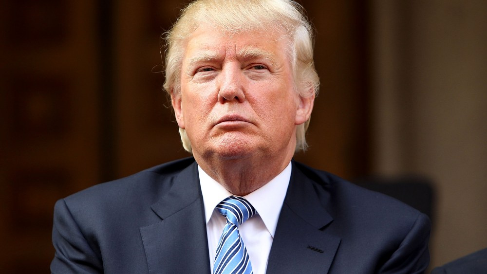 Donald Trump listens at the Trump International Hotel Washington, D.C, Groundbreaking Ceremony at Old Post Office on July 23, 2014. (Photo by Paul Morigi/WireImage/Getty)