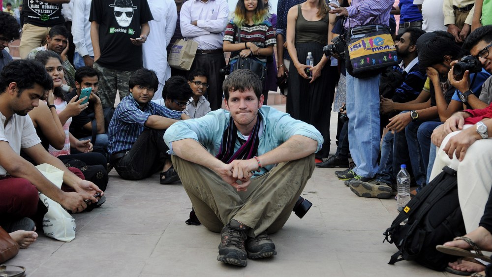 American photographer and blogger Brandon Stanton with his young followers in Central Park at Connaught Place on Sep. 12, 2014 in New Delhi, India. (Photo by Vipin Kumar/Hindustan Times/Getty)