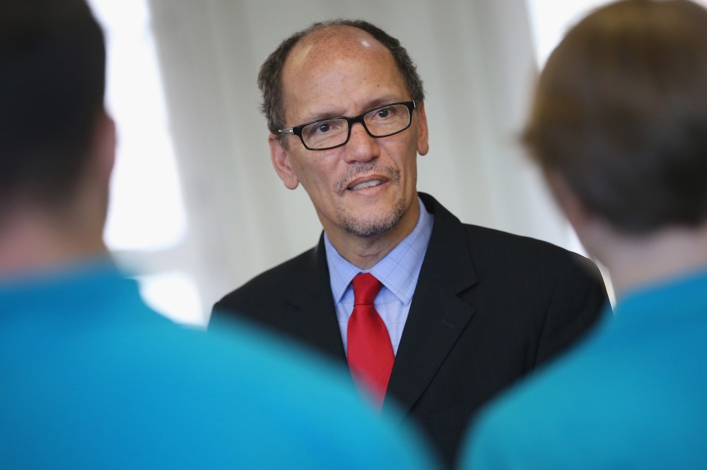 U.S. Labor Secretary Thomas Perez chats with trainees at the Siemens training facility on Oct. 28, 2014 in Berlin, Germany. (Photo by Sean Gallup/Getty)