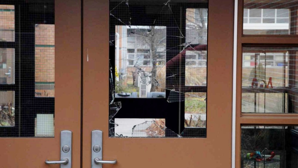 This handout crime scene evidence photo provided by the Connecticut State Police shows a damaged door of the Sandy Hook Elementary School following the Dec. 14, 2012 shooting rampage. (Photo by Connecticut State Police/Getty)