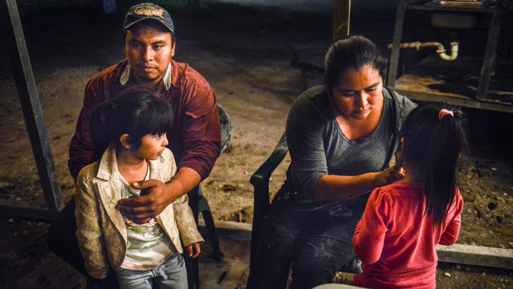 Ramiro Beltran and his wife Alma Hernandez Beltran, both undocumented immigrants, sit with their daughters who are U.S. citizens, Kimberly Beltran and Kayla Beltran, in Alamo, Texas, Nov. 24, 2014. (Photo by Matthew Busch for The Washington Post/Getty)