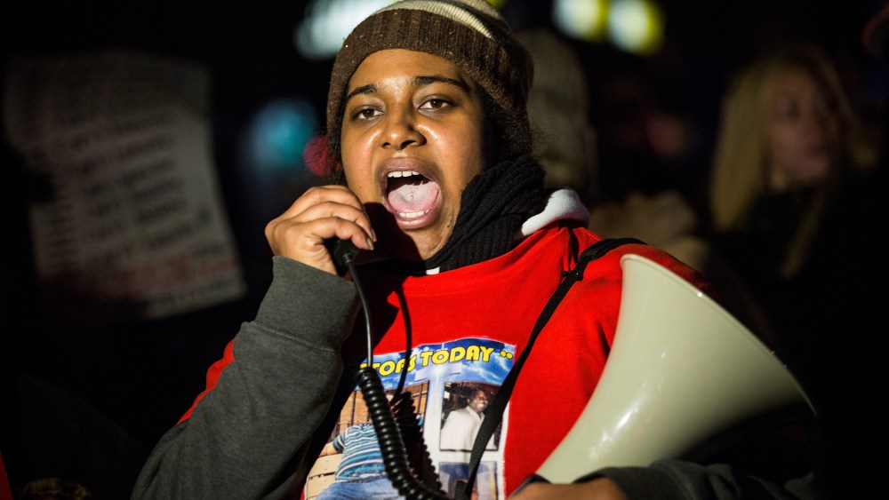 Erica Garner, daughter of Eric Garner, leads a march protesting in Staten Island, N.Y., after a grand jury's decision not to indict a police officer involved in her father's chokehold death in July, on Dec. 11, 2014. (Photo by Andrew Burton/Getty)