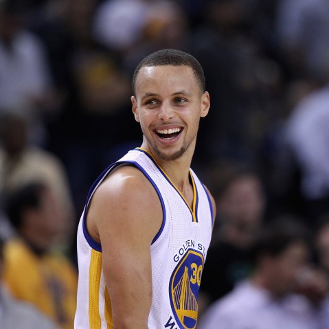 Stephen Curry #30 of the Golden State Warriors smiles during their game against the Indiana Pacers at ORACLE Arena on Jan. 7, 2015 in Oakland, Calif. (Photo by Ezra Shaw/Getty)