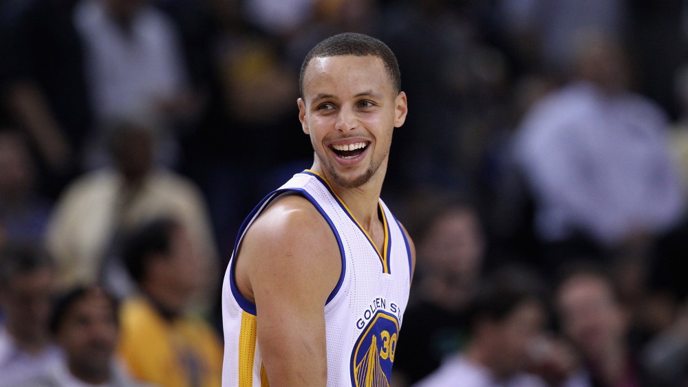 Stephen Curry #30 of the Golden State Warriors smiles during their game against the Indiana Pacers at ORACLE Arena on Jan. 7, 2015 in Oakland, Calif. (Photo by Ezra Shaw/Getty)