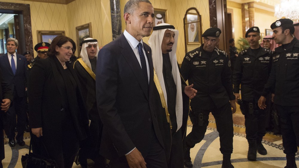 U.S. President Obama walks alongside Saudi's newly appointed King Salman at Erga Palace in Riyadh on Jan. 27, 2015 following his arrival in Saudi Arabia. (Photo by Saul Loeb/AFP/Getty)