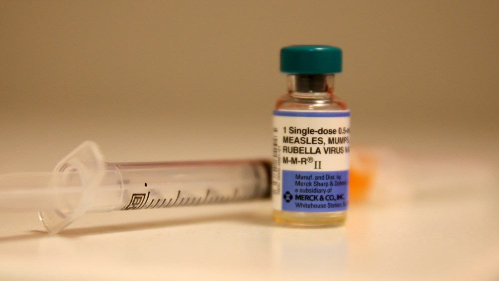 In this photo illustration, a bottle containing a measles vaccine is pictured. (Photo by Joe Raedle/Getty)