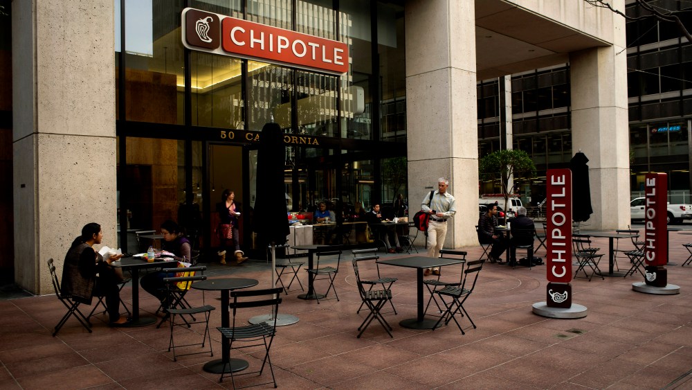 Customers dine outside at a Chipotle Mexican Grill in San Francisco, Calif., Feb. 2, 2015. (Photo by David Paul Morris/Bloomberg via Getty)