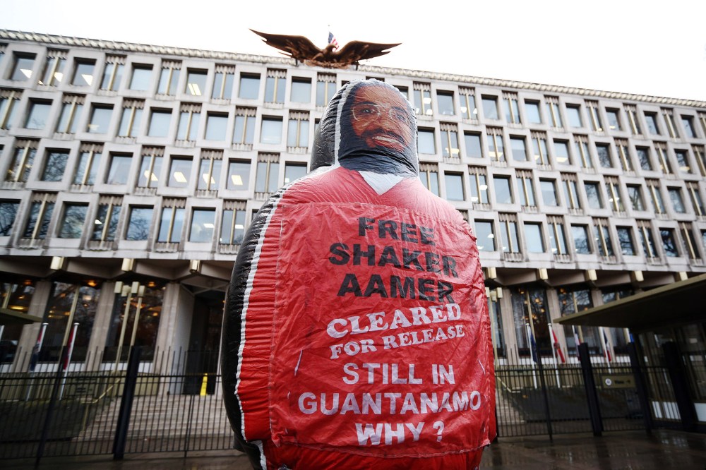 A giant inflatable figure of Shaker Aamer is pictured during a protest outside the U.S embassy on Feb. 13, 2015 in London, England. (Photo by Carl Court/Getty)