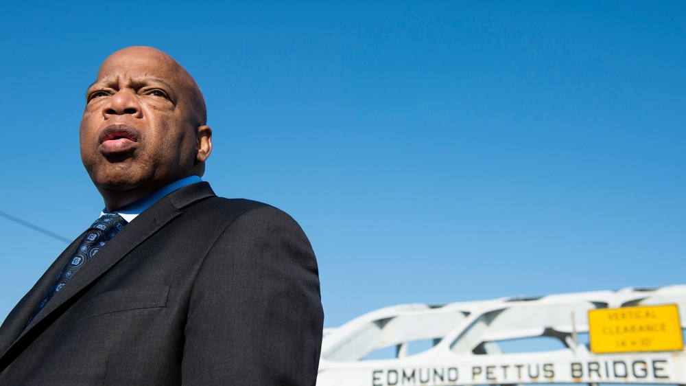 Rep. John Lewis, D-Ga., stands on the Edmund Pettus Bridge in Selma, Ala., in between television interviews on Feb. 14, 2015. (Photo by Bill Clark/CQ Roll Call/Getty).