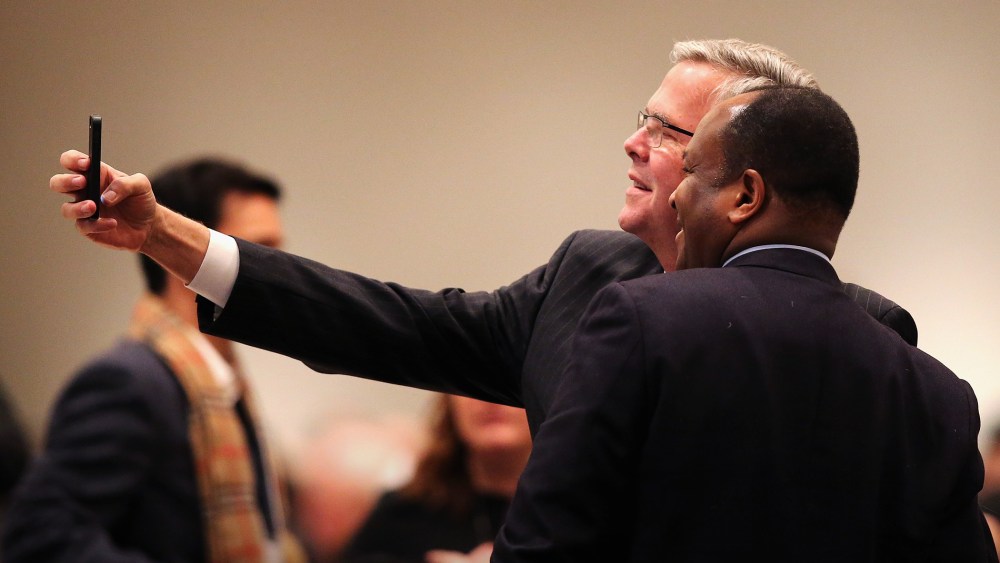 Former Florida Governor Jeb Bush takes a selfie with a guest at a luncheon on Feb. 18, 2015 in Chicago, Ill. (Photo by Scott Olson/Getty)