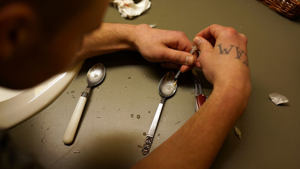 Drugs are prepared to shoot intravenously by a user addicted to heroin on Feb. 6, 2014 in St. Johnsbury, Vt. (Photo by Spencer Platt/Getty)