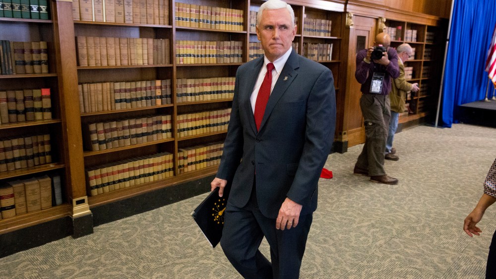 Indiana Gov. Mike Pence leaves a press conference March 31, 2015 at the Indiana State Library in Indianapolis, Indiana. (Photo by Aaron P. Bernstein/Getty)
