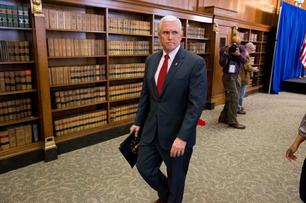 Indiana Gov. Mike Pence leaves a press conference March 31, 2015 at the Indiana State Library in Indianapolis, Indiana. (Photo by Aaron P. Bernstein/Getty)