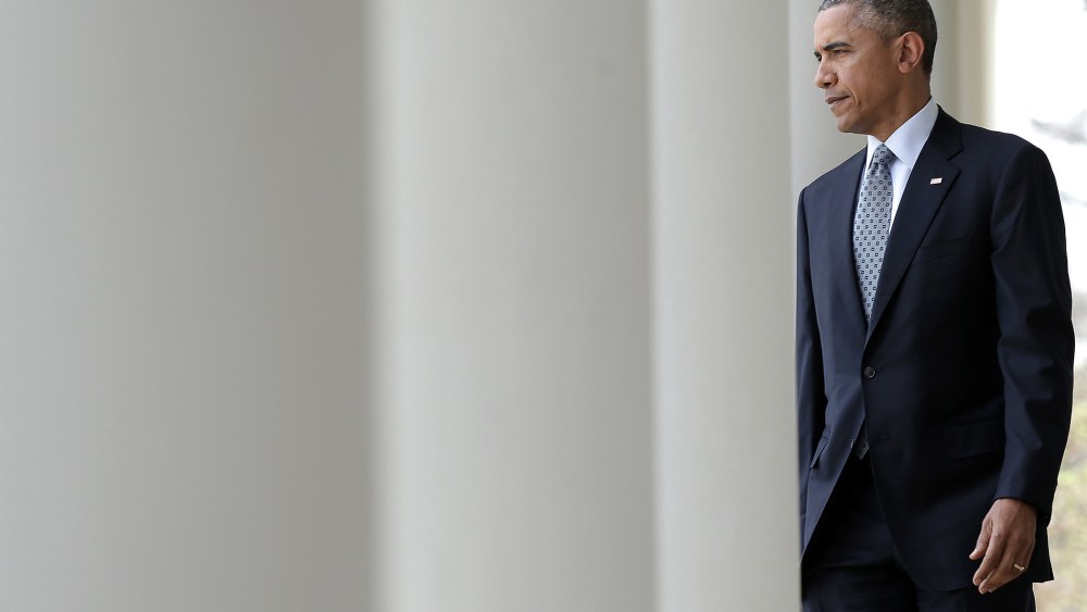 President Barack Obama walks from the Oval Office to the Rose Garden to deliver remarks on April 2, 2015 in Washington, D.C. (Photo by Win McNamee/Getty)
